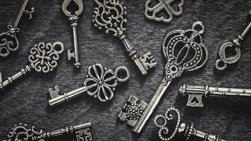 Vintage keys on gray wood background photo