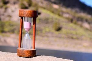 Hourglass with sand photo