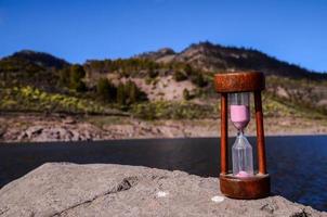 Hourglass with sand photo