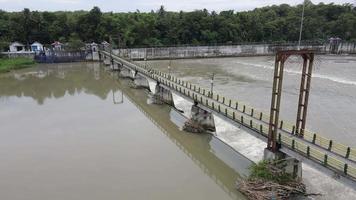 Aerial small dam river in big river Indonesia video