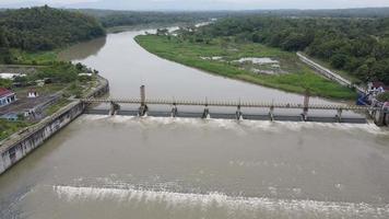 Aerial small dam river in big river Indonesia video