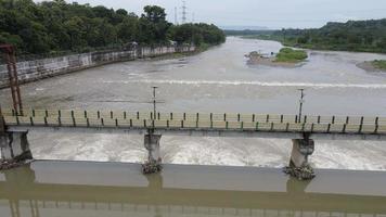 Aerial small dam river in big river Indonesia video