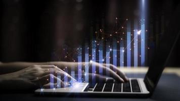Businessman holding a graph goal of business Investor,analysis economic and calculates financial data and target for long-term investments and profitability in future on digital data system manager. photo
