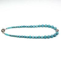 Pendant necklace bracelet gemstone on white background colored photo
