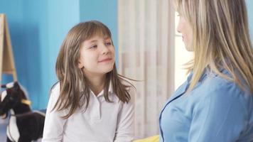 Cute little girl is telling her mother, talking to her. Happy and cheerful little girl is telling something to her mother, expressing her problems, wishes. video