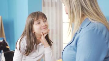 The mother and the little girl are chatting alone, having trouble, trying to solve the problems. The mother is chatting with her cute little daughter and listening to her problems and requests. video