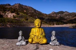 Buddha statue on the rock photo