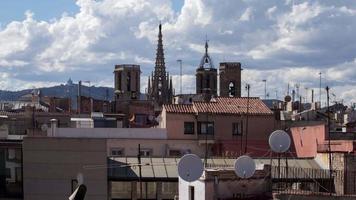 the rooftops of barcelona shot from a terrace in the centre of the city. video