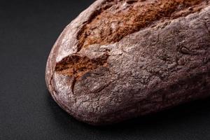 Delicious fresh brown sourdough bread with grains photo