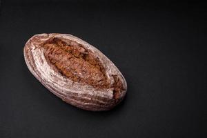 Delicious fresh brown sourdough bread with grains photo