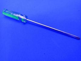 screwdriver closeup isolated with blue background photo