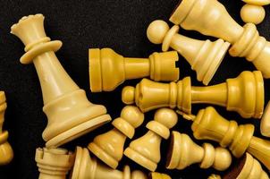 Chess pieces on dark background photo