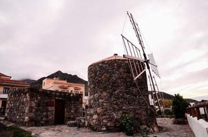 Traditional stone windmill photo