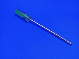 screwdriver closeup isolated with blue background photo