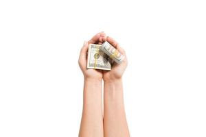 parte superior ver de dólar billetes en hembra manos en blanco aislado antecedentes. Jubilación y pobreza concepto foto