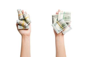 Top view of dollar bills in tubes in female hands on white isolated background. Business concept photo