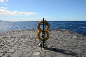 Lifebuoy on the coast photo