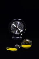 Hourglass on dark background photo