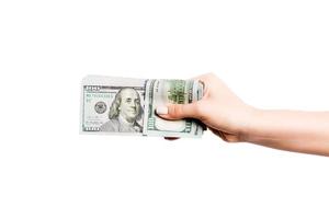 dólar billetes en hembra mano en blanco aislado antecedentes. negocio concepto foto