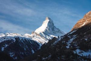 Scenic sunrise or sunset view of Matterhorn - one of the most famous and iconic Swiss mountains, Zermatt, Valais, Switzerland photo