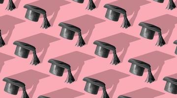 Pattern with black graduated cap pink background with hard shadow. Education background photo