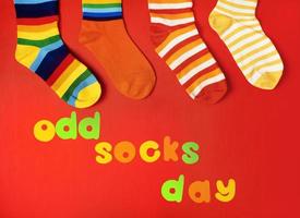 Odd Socks Day. Lonely Sock Day. The social problem of bullying. Strange socks as a symbol of Down syndrome photo