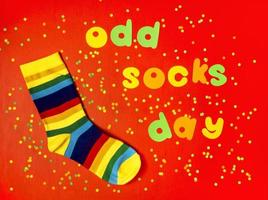 Odd Socks Day. Lonely Sock Day. The social problem of bullying. Strange socks as a symbol of Down syndrome photo