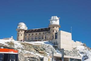 Observatory and hotel on Mount Gornergrat. Landscape of the hotel building and the Matterhorn mountains. Zermatt, Switzerland. photo