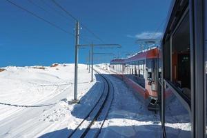 The train of Gonergratbahn running to the Gornergrat station and Stellarium Observatory - famous touristic place with clear view to Matterhorn. Glacier Express train. photo