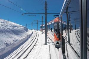 The train of Gonergratbahn running to the Gornergrat station and Stellarium Observatory - famous touristic place with clear view to Matterhorn. Glacier Express train. photo