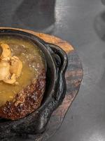 Extra beef steak with noodles and mushroom sauce. The photo is suitable to use for food background, poster and food content media.