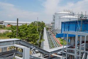 Arial view of power plant project with blue sky and cloudy vibes. The photo is suitable to use for industry background photography, power plant poster and electricity content media.