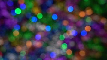 Out of focus creative Christmas holiday backdrop, abstract blurry bokeh background effect. Defocus glowing lights celebration texture for use at graphic design video