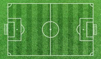 estadio de fútbol. campo de fútbol de hierba de rayas de vista superior. césped verde con un patrón de líneas para el fondo deportivo. foto
