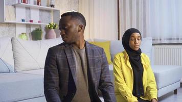 Muslim African married couple praying at home. African Muslim married couple fulfilling their duty to worship Allah. Islamic religion concept. video