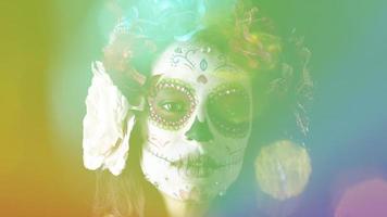 Beautiful woman with custom designed candy skull mexican day of the dead face make up video