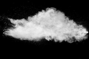 White talcume powder explosion on black background. White dust particles splash. photo