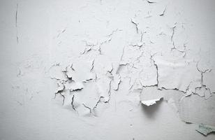 cracked paint on wall in room photo