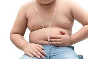 Hand fat boy touch on his belly isolated, stomachache photo