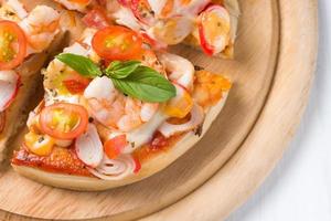 seafood Pizza on wood palte photo