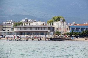 View from the Aegean sea to the shore of Turkey. Houses on the coast of the Aegean Sea photo