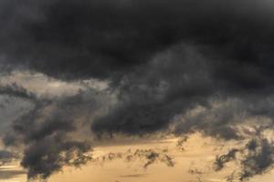 Dramatic stormy clouds in sky during rainy weather. Natural overcast weather background photo