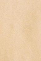 Sheet of yellow abstract cardboard useful as background. Close-up of texture material carton photo