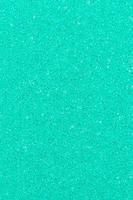 Turquoise color foam porous abstract background. Vertical composition for design, colored backdrop photo