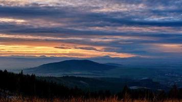 Sunset dramatic sky over mountains shape photo