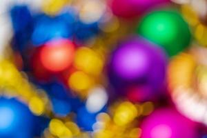 Defocused shining Christmas balls holiday decorations, abstract blurry bokeh background effect photo