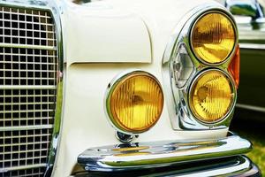 Closeup headlight of retro car photo