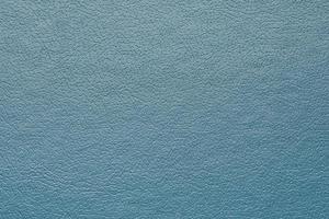 Synthetic blue leather for pattern background. Closeup decoration texture material photo