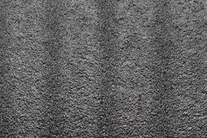 Black abstract polystyrene foam texture background. Close-up styrofoam material photo