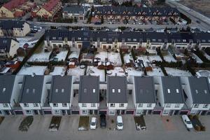 Aerial drone view of residential neighborhood in winter season photo